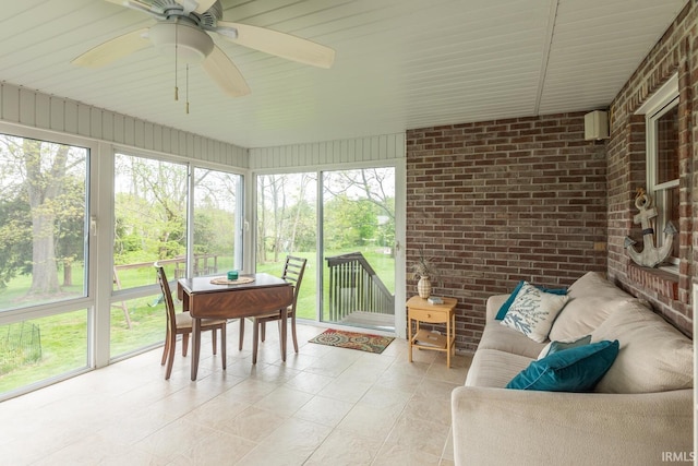 sunroom with ceiling fan and outdoor lounge area