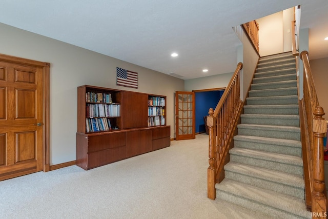 staircase featuring carpet floors, baseboards, recessed lighting, and french doors