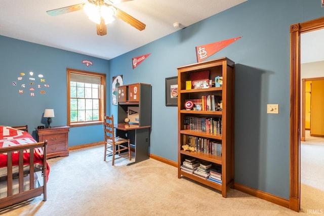 bedroom featuring carpet floors, an office area, and baseboards
