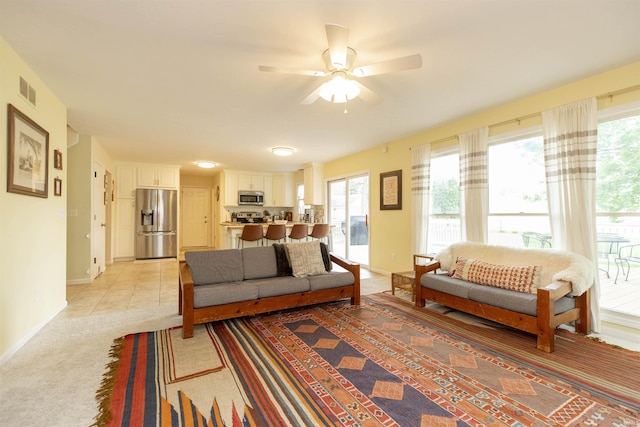 14375 Pheasant Ct, Mishawaka, IN 46545 - living area featuring baseboards, healthy amount of natural light, ceiling fan, and light carpet