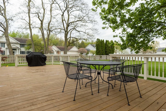 14375 Pheasant Ct, Mishawaka, IN 46545 - wooden terrace featuring outdoor dining space, a residential view, and a grill