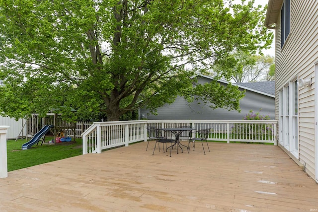 14375 Pheasant Ct, Mishawaka, IN 46545 - wooden deck with fence, a playground, and outdoor dining area