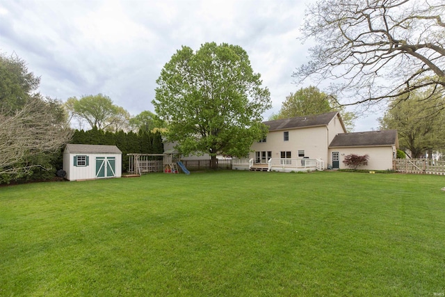 14375 Pheasant Ct, Mishawaka, IN 46545 - view of yard with a playground, a shed, an outdoor structure, and a wooden deck