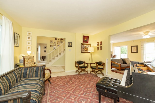14375 Pheasant Ct, Mishawaka, IN 46545 - living room featuring stairway, carpet, and ceiling fan