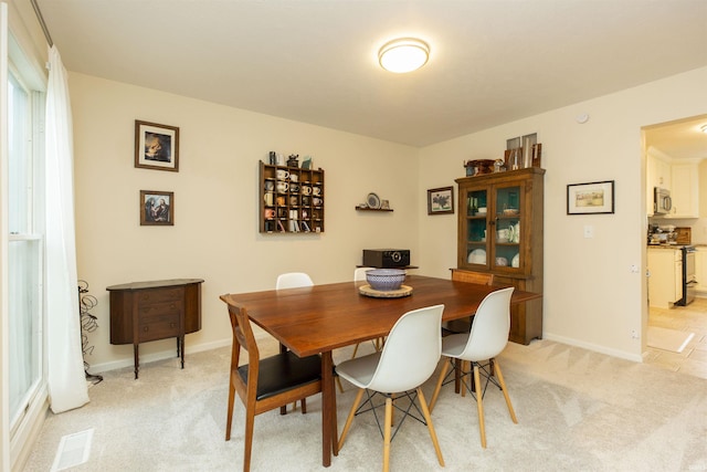 14375 Pheasant Ct, Mishawaka, IN 46545 - dining space featuring light carpet and baseboards
