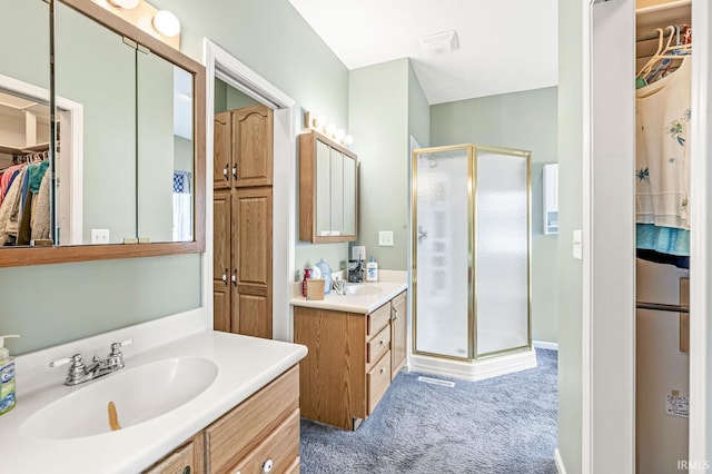 3700 Saint Andrews Pl, Elkhart, IN 46517 - bathroom with a stall shower, two vanities, and a spacious closet