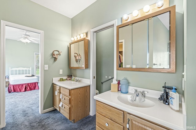 3700 Saint Andrews Pl, Elkhart, IN 46517 - ensuite bathroom with two vanities and a ceiling fan