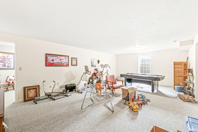 3700 Saint Andrews Pl, Elkhart, IN 46517 - recreation room featuring carpet floors, baseboards, and a textured ceiling