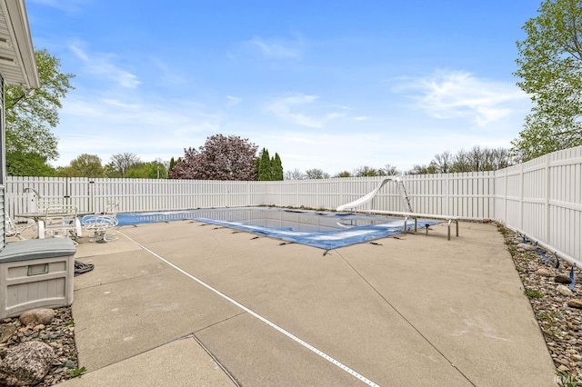 3700 Saint Andrews Pl, Elkhart, IN 46517 - view of swimming pool with a patio, a fenced backyard, and a water slide