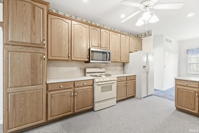 3700 Saint Andrews Pl, Elkhart, IN 46517 - kitchen featuring white appliances, light countertops, a ceiling fan, light colored carpet, and recessed lighting