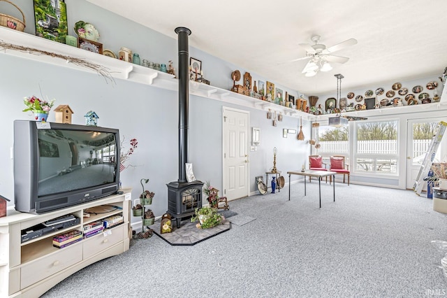 3700 Saint Andrews Pl, Elkhart, IN 46517 - game room with a wood stove, carpet, and ceiling fan