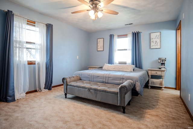 3029 Carroll Rd, Fort Wayne, IN 46818 - bedroom with light carpet, baseboards, and ceiling fan