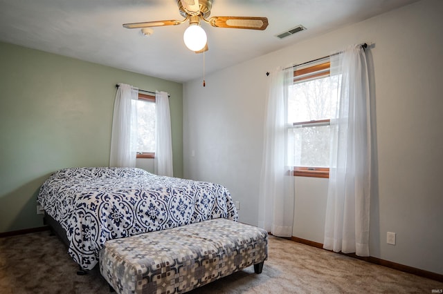 3029 Carroll Rd, Fort Wayne, IN 46818 - carpeted bedroom with baseboards and a ceiling fan