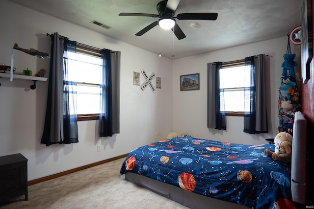 3029 Carroll Rd, Fort Wayne, IN 46818 - bedroom with multiple windows, carpet flooring, baseboards, and a ceiling fan
