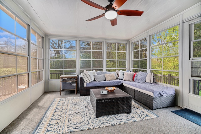 sunroom / solarium featuring plenty of natural light, a ceiling fan, and outdoor lounge area