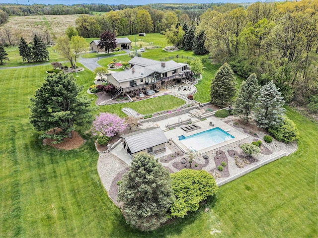view of subject property featuring a pool