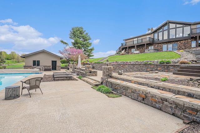 view of patio featuring an outdoor pool, a deck, and stairs