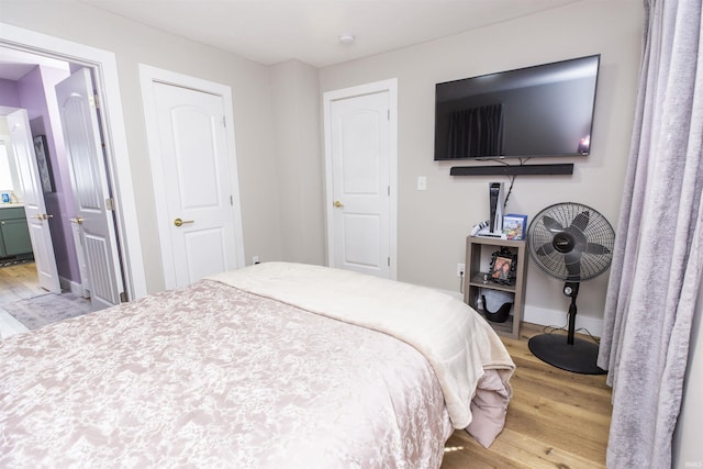 bedroom with light wood-type flooring