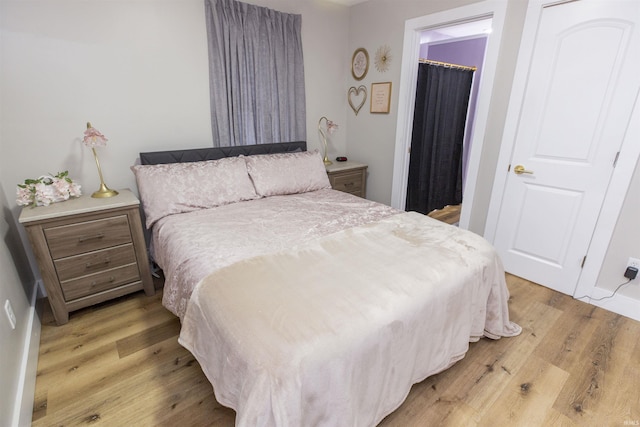 bedroom with light wood-style flooring