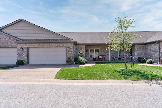 8455 Nolia Ln, Newburgh, IN 47630 - view of front of home with driveway, a front lawn, a garage, brick siding, and a shingled roof