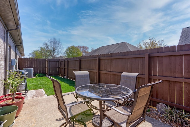 8455 Nolia Ln, Newburgh, IN 47630 - view of patio / terrace featuring outdoor dining area, a fenced backyard, and central air condition unit