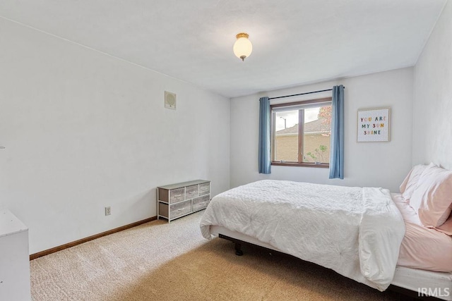 bedroom featuring carpet flooring and baseboards
