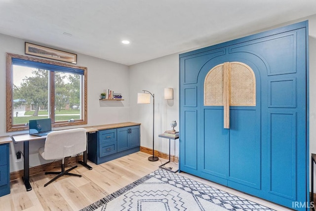 home office featuring light wood-style flooring, baseboards, and recessed lighting