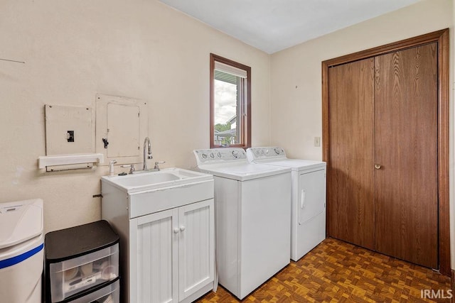 washroom featuring washer and clothes dryer and cabinet space