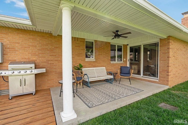 view of patio / terrace with a ceiling fan and a grill