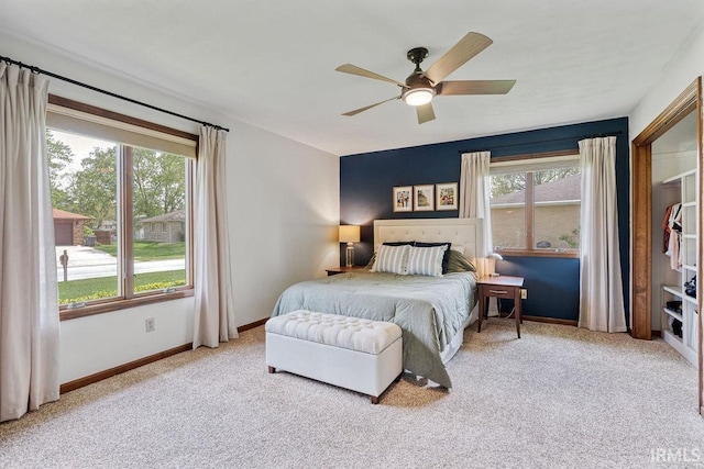 carpeted bedroom with baseboards and ceiling fan
