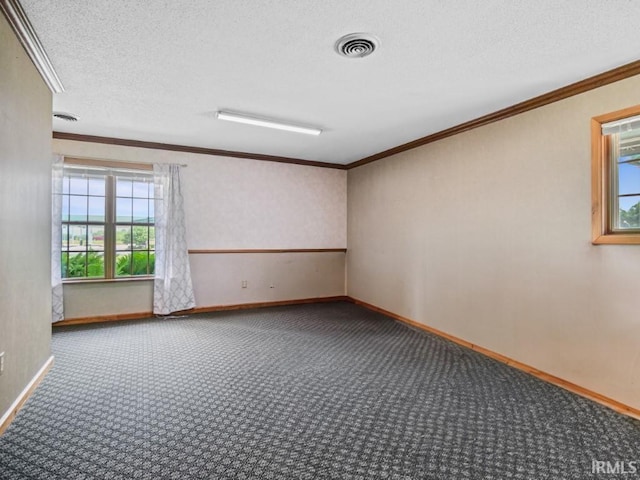 carpeted spare room with baseboards, crown molding, and a textured ceiling