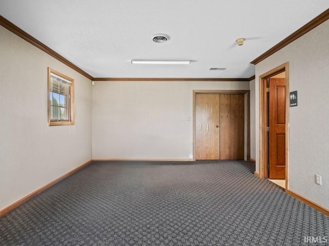 spare room with carpet, baseboards, and ornamental molding