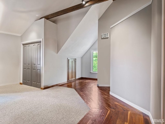 additional living space featuring lofted ceiling and baseboards