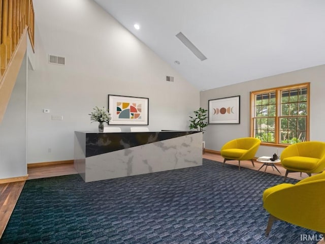 welcome area featuring high vaulted ceiling and recessed lighting
