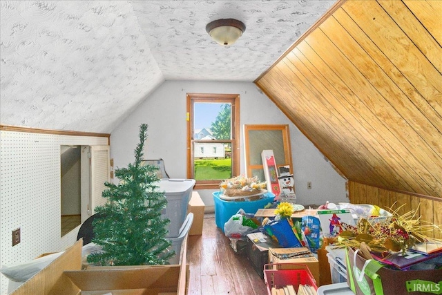 510 W Washington St, Oakland City, IN 47660 - additional living space with wood-type flooring, lofted ceiling, and a textured ceiling
