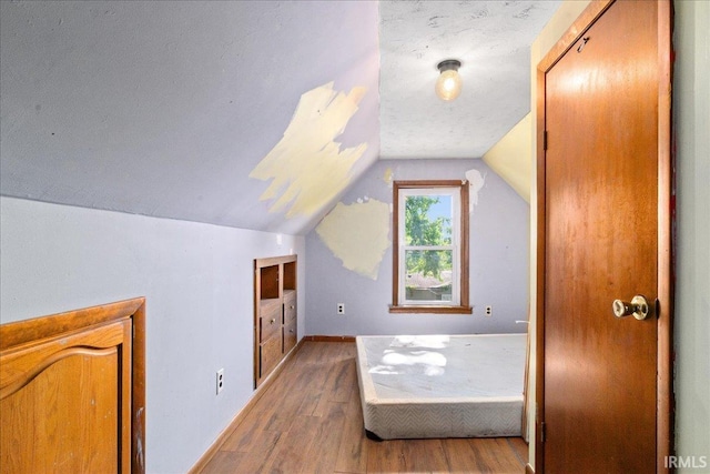 510 W Washington St, Oakland City, IN 47660 - bonus room featuring wood finished floors, vaulted ceiling, and baseboards