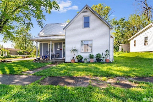 510 W Washington St, Oakland City, IN 47660 - back of property with a porch, a yard, and metal roof