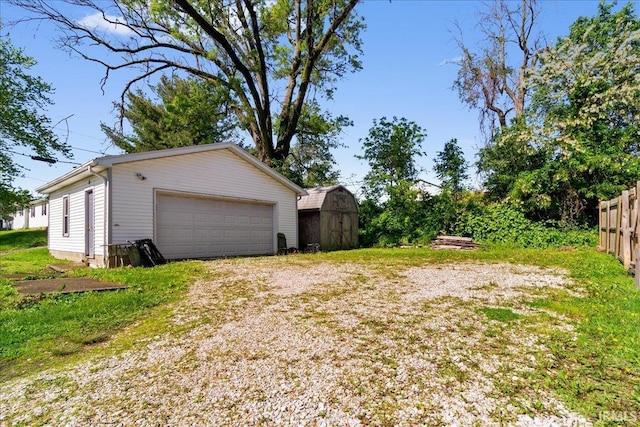 510 W Washington St, Oakland City, IN 47660 - detached garage with a storage shed and fence