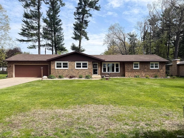 single story home with an attached garage, concrete driveway, brick siding, and a front lawn