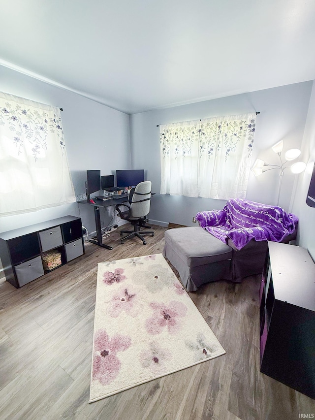 home office with wood finished floors