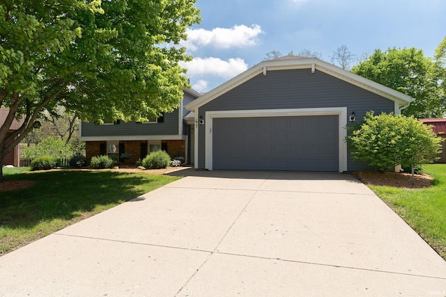 view of front facade with a front yard and concrete driveway