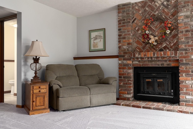 carpeted living room with a fireplace and baseboards