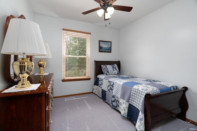 carpeted bedroom with baseboards and ceiling fan
