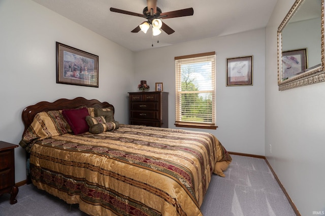 bedroom with carpet flooring, baseboards, and a ceiling fan
