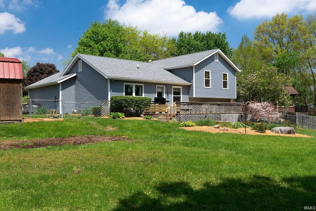 view of front facade with a shingled roof and a deck