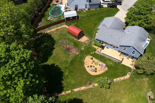 aerial view of property and surrounding area with a pool area