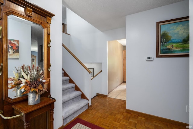 staircase featuring baseboards