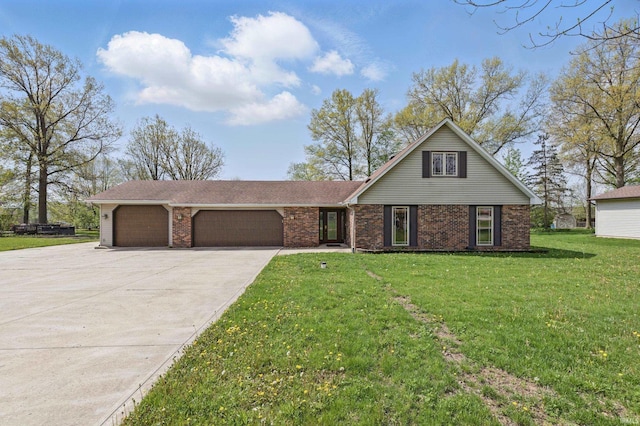 traditional-style house featuring a garage, driveway, brick siding, and a front yard