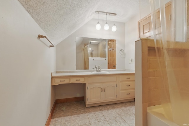 full bath featuring a textured ceiling, a shower with shower door, lofted ceiling, tile patterned floors, and vanity