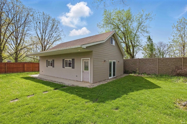 rear view of property with a shingled roof